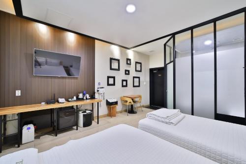 En eller flere senge i et værelse på Hotel ARA - Busan Haeundae