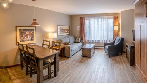 a living room with a couch and a table at Cahilty #214 home in Sun Peaks