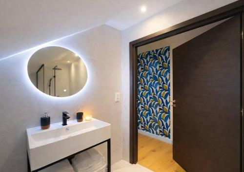a bathroom with a sink and a mirror at White House Dhavernas - Résidence Privée - Amiens - Parking Gratuit in Amiens
