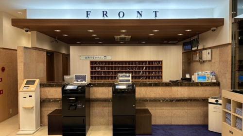 a store with a front counter in a store at Toyoko Inn Nishitetsu Kurume eki Higashi guchi in Kurume