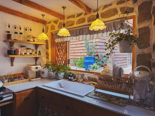 a kitchen with a sink and a window at SIA Home in Da Lat