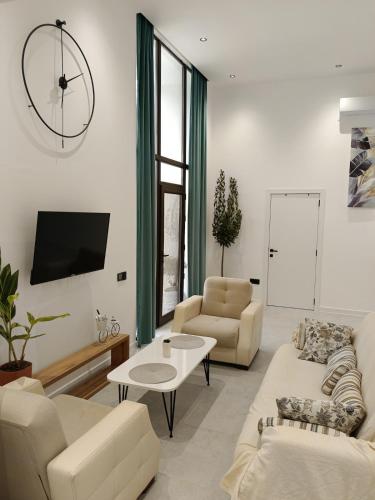 Televizorius ir (arba) pramogų centras apgyvendinimo įstaigoje Harmony Hideaway Gabala