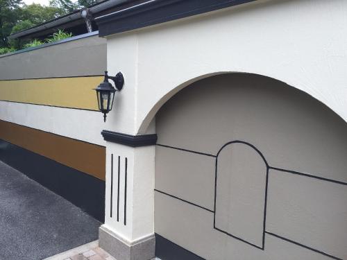 a building with an arch with a light on it at Hotel Jardin de Fleurs (Adult Only) in Kyoto