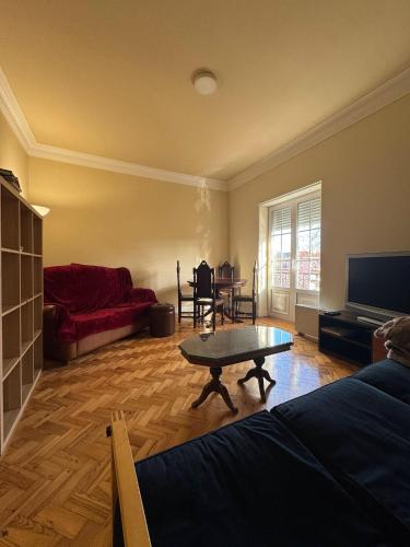 a living room with a couch and a coffee table at Varanda dos Poetas in Lisbon