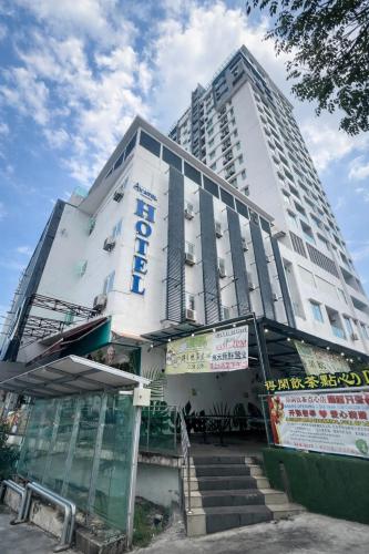 a tall building with stairs in front of it at Avatel Jelutong PWCC in George Town