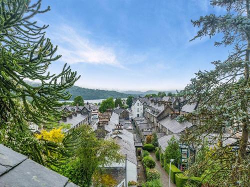 a view of a town with houses and trees at Howe Cottage in Bowness-on-Windermere