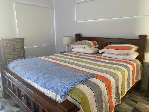 a bed with two pillows on it in a room at Southerly Studio in Augusta