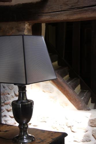 a lamp sitting on top of a table at L'Hibernie in Rochefort-en-Yvelines