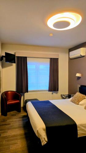 Postel nebo postele na pokoji v ubytování Belrom Hotel