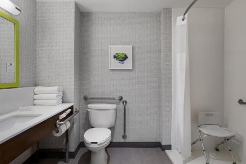a bathroom with a toilet and a sink at Hampton Inn by Hilton Kamloops in Kamloops