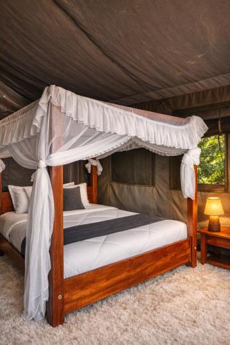 a bedroom with two bunk beds in a tent at Endeem mara resort in Ololaimutiek