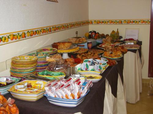 a table with many plates of food on it at Locanda Degli Agrumi in Conca dei Marini