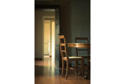 a dining room with a table and chairs at Casa Girardi in Peschiera del Garda