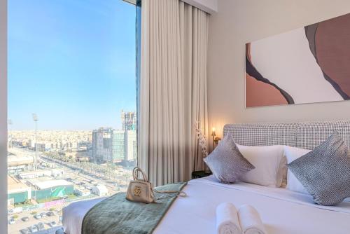 a hotel room with a view of a city at Stella Stays King Fahd - Furnished Apartments in Riyadh