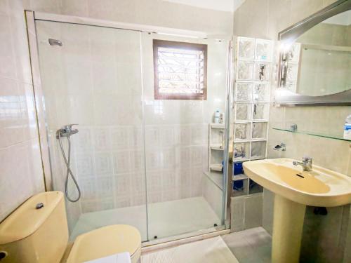 a bathroom with a shower and a toilet and a sink at Finca Hoya del Pino in Arafo