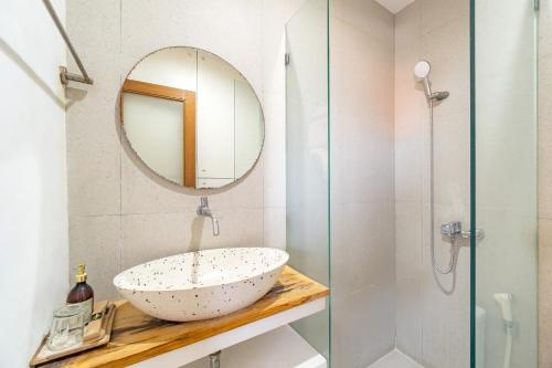 a bathroom with a sink and a mirror at Srikrisna in Seminyak