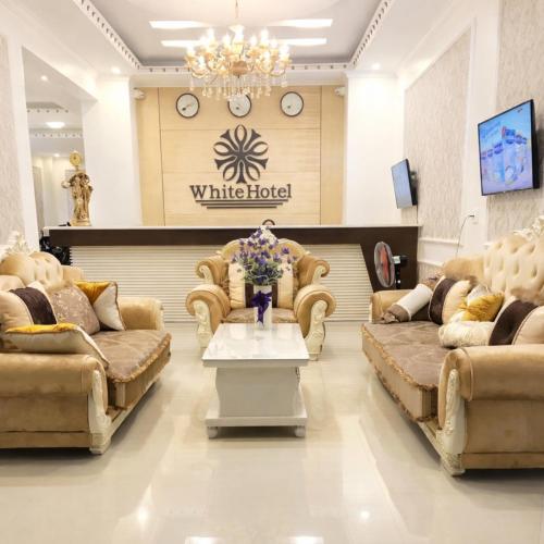 a waiting room with couches and a table at White Hotel Nghệ An in Vinh