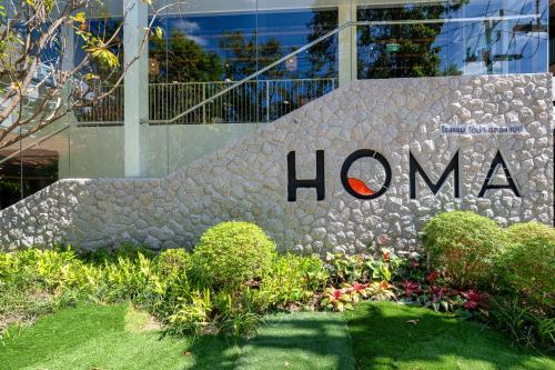 a sign in front of a building with the hana sign at HOMA Chalong Bay in Ban Klang