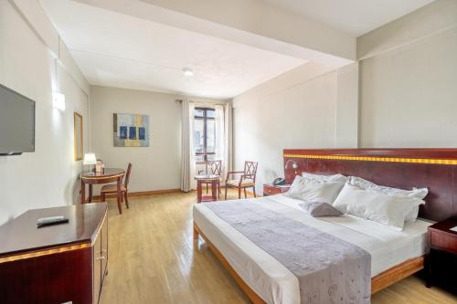 Lova arba lovos apgyvendinimo įstaigoje Gold Crest Hotel