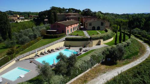an aerial view of a villa with a swimming pool at Borgo di Colleoli Resort in Colleoli