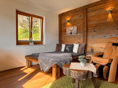 a living room with a couch and a table at Wind Buam Huette in Sankt Lorenzen ob Murau