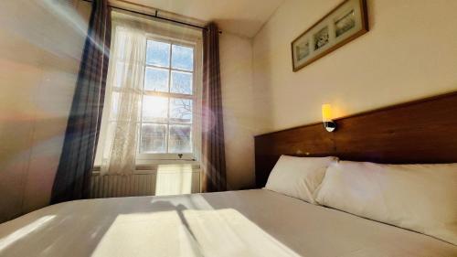 Llit o llits en una habitació de Arriva Hotel