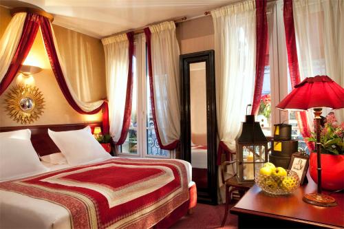 Кровать или кровати в номере Hotel Britannique