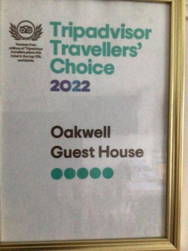 a framed sign for a guest house at Oakwell Guest House in Bridlington