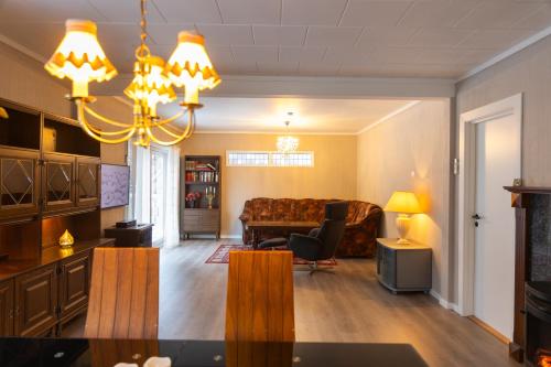 a living room with a couch and a table at Spacious Apartment - City Center in Stryn