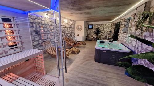 a bathroom with a shower and a sink in a room at Crossroads Hideaway in Brod na Kupi