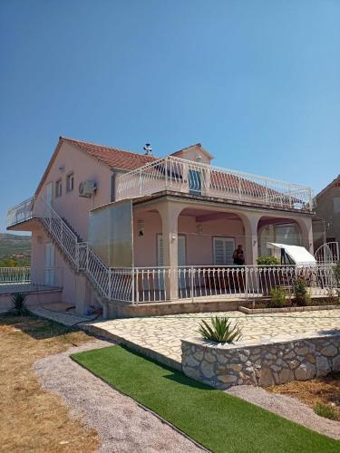 a house with a large porch and a balcony at House Villa Zvonko Near NP Krka in Sedramić