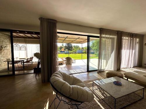 a living room with a couch and a table at Villa Terra Akal in Essaouira