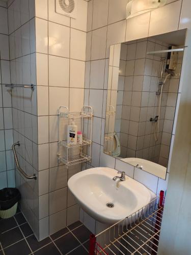 a bathroom with a sink and a mirror at Avatara A Ocean Views by malai in Ban Tha Fat