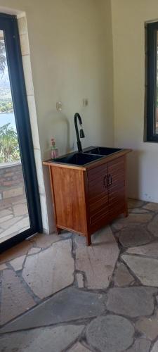 a sink in a room with a window at cyuza paradise island in Nyarugina