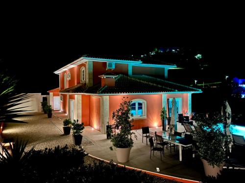 a house with a table in front of it at night at Solar Do Douro in Santa Cruz do Douro