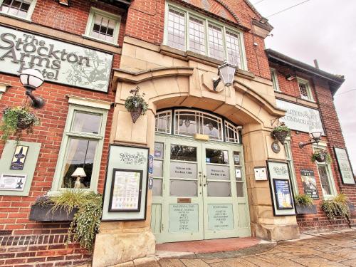 a brick building with a sign above the door at The Stockton Arms in Stockton-on-Tees
