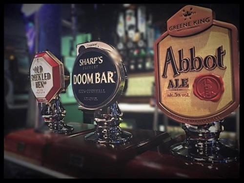 a couple of signs on a counter in a bar at The Stockton Arms in Stockton-on-Tees