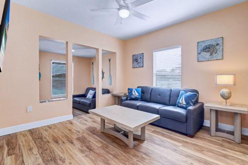 a living room with a couch and a table at East Shore Paradise #448 in Clearwater Beach