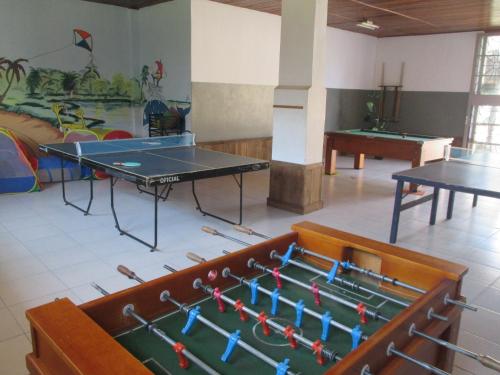 a room with a ping pong table and a ping pong ball at Hotel Santiago in Lindóia