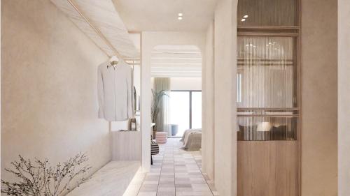 a hallway leading to a living room with a door at Pefkos Blue in Pefki