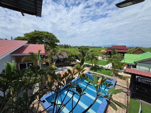 an aerial view of a resort with a pool at Dangau Sala D'Kontena in Alor Setar