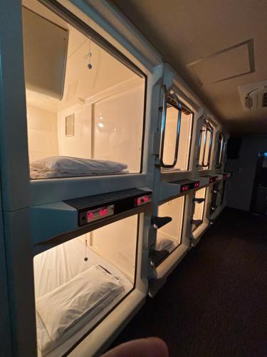 an open refrigerator in the side of an rv at Capsule Hotel Sauna G -topia male Only in Funabashi