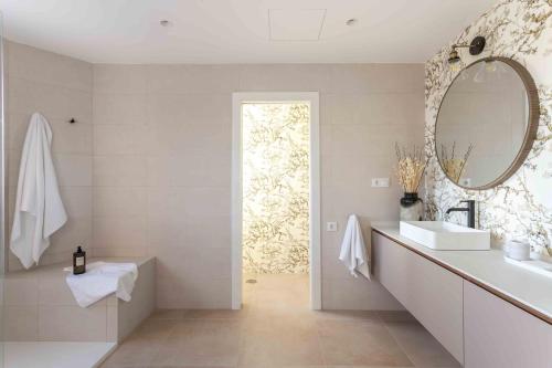 a bathroom with a sink and a mirror at A paradise with ocean views in Conil de la Frontera