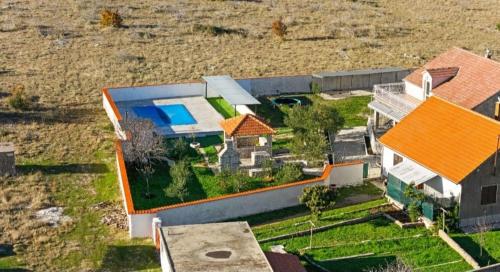 an aerial view of a house with a swimming pool at House Villa Zvonko Near NP Krka in Sedramić