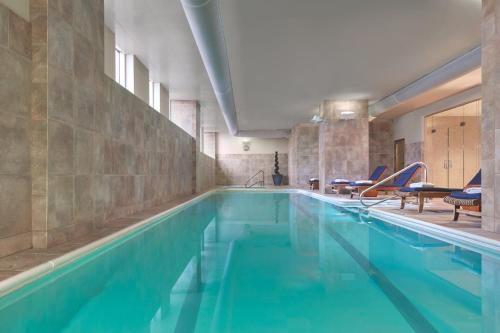 a swimming pool with blue water in a building at Loews New Orleans Hotel in New Orleans