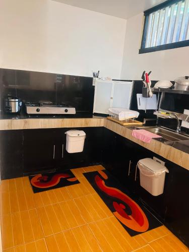 a kitchen with two pairs of scissors on the floor at El Nido Homestay in El Nido
