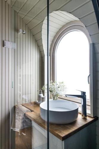 a bathroom with a large tub on a wooden counter at Iglupark in Tallinn