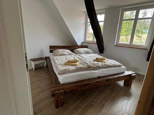 a bedroom with a bed with two pillows on it at Exterhof in Rinteln