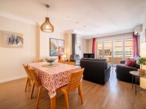a living room with a table and chairs and a couch at Apartment Mariners 4 by Interhome in Alcudia