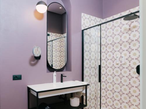 a bathroom with a sink and a shower at Unconventional Sorrento Coast in Sant'Agnello